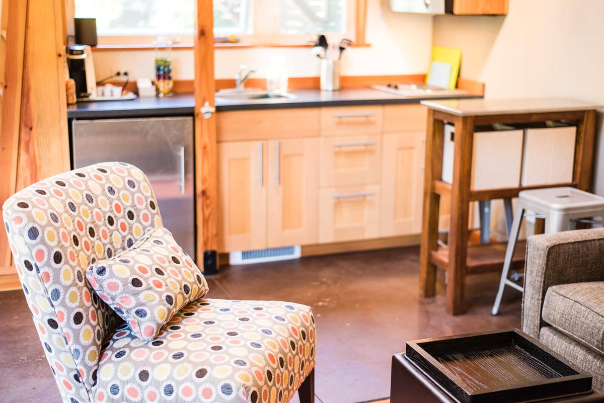 Colorful accent chair in the kitchen area of a remodeled ADU by CB Construction in Seattle