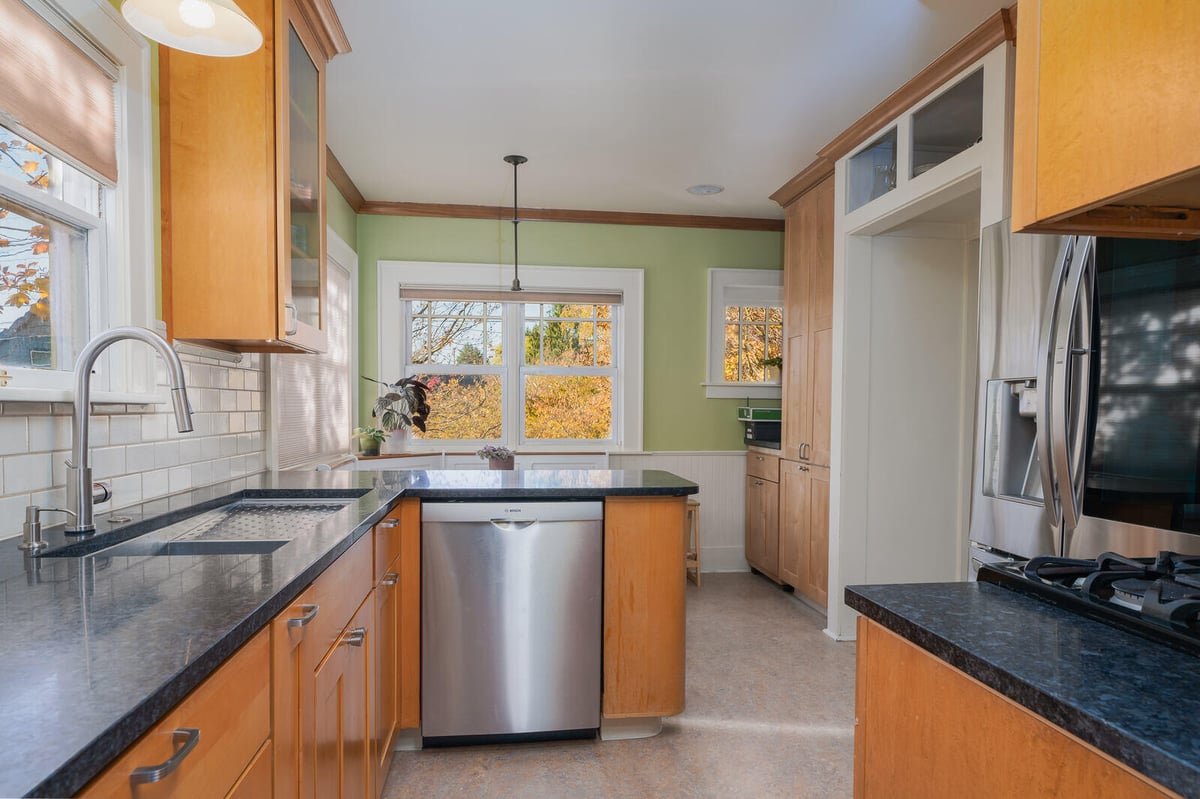 Bright Seattle kitchen with large windows and modern design by CB Construction