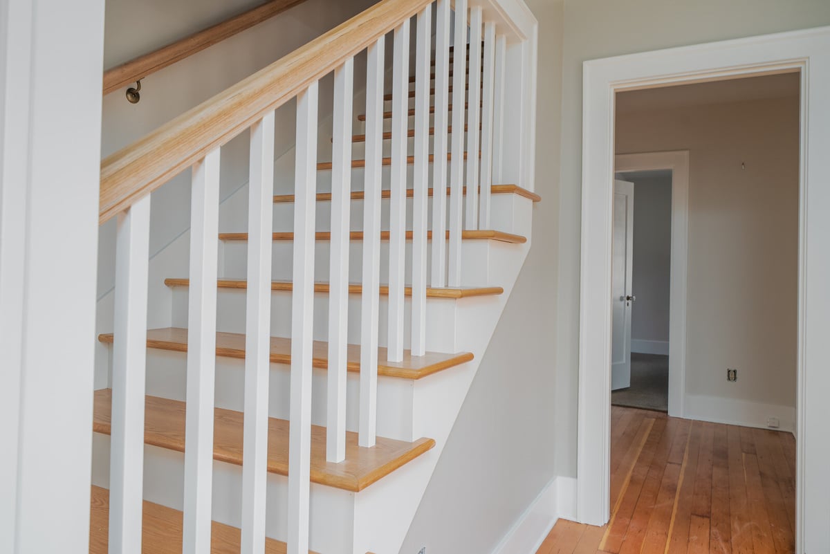CB Constructions remodel in Seattle featuring a wooden staircase and modern interior design