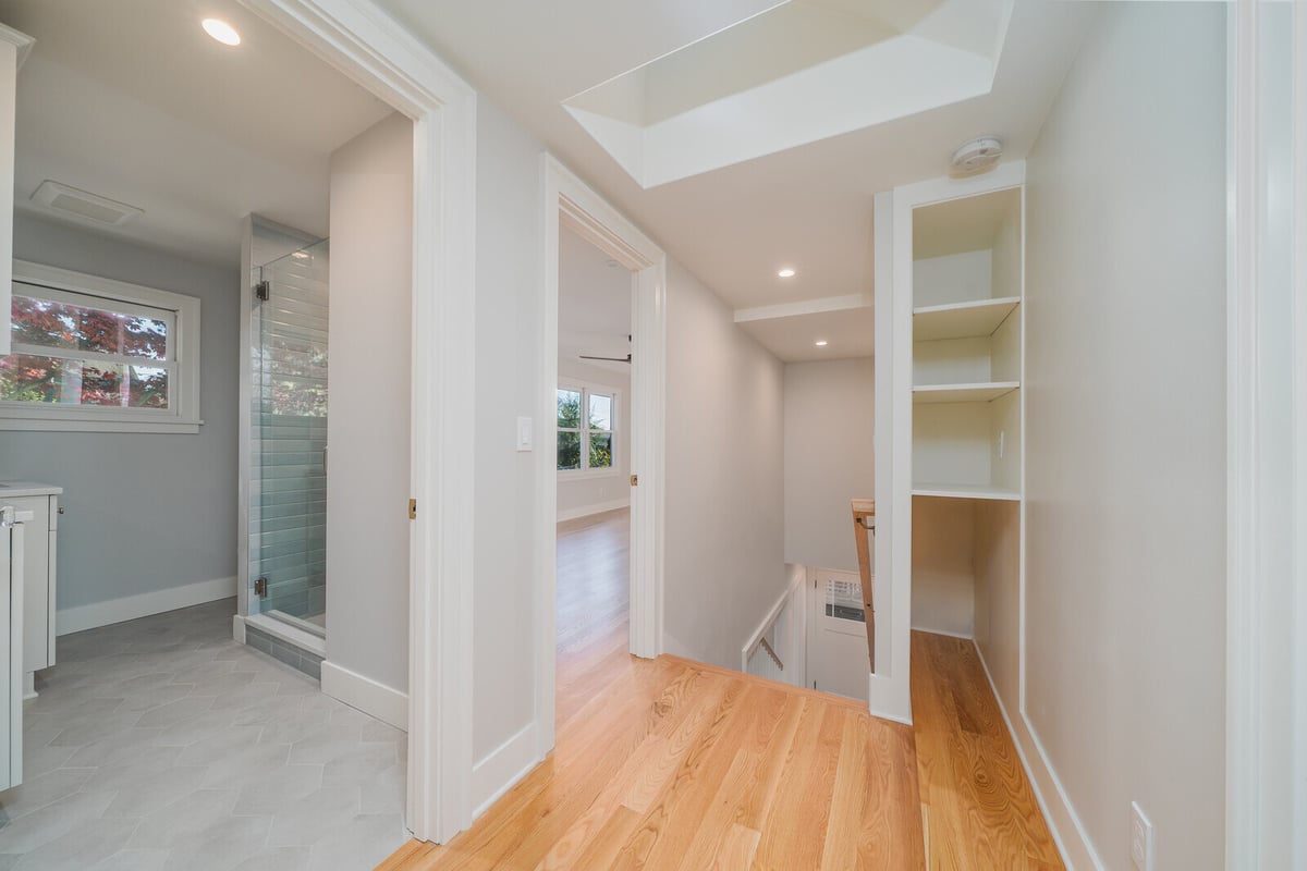 Hallway with access to bathroom and living area, part of a Seattle home remodel by CB Construction