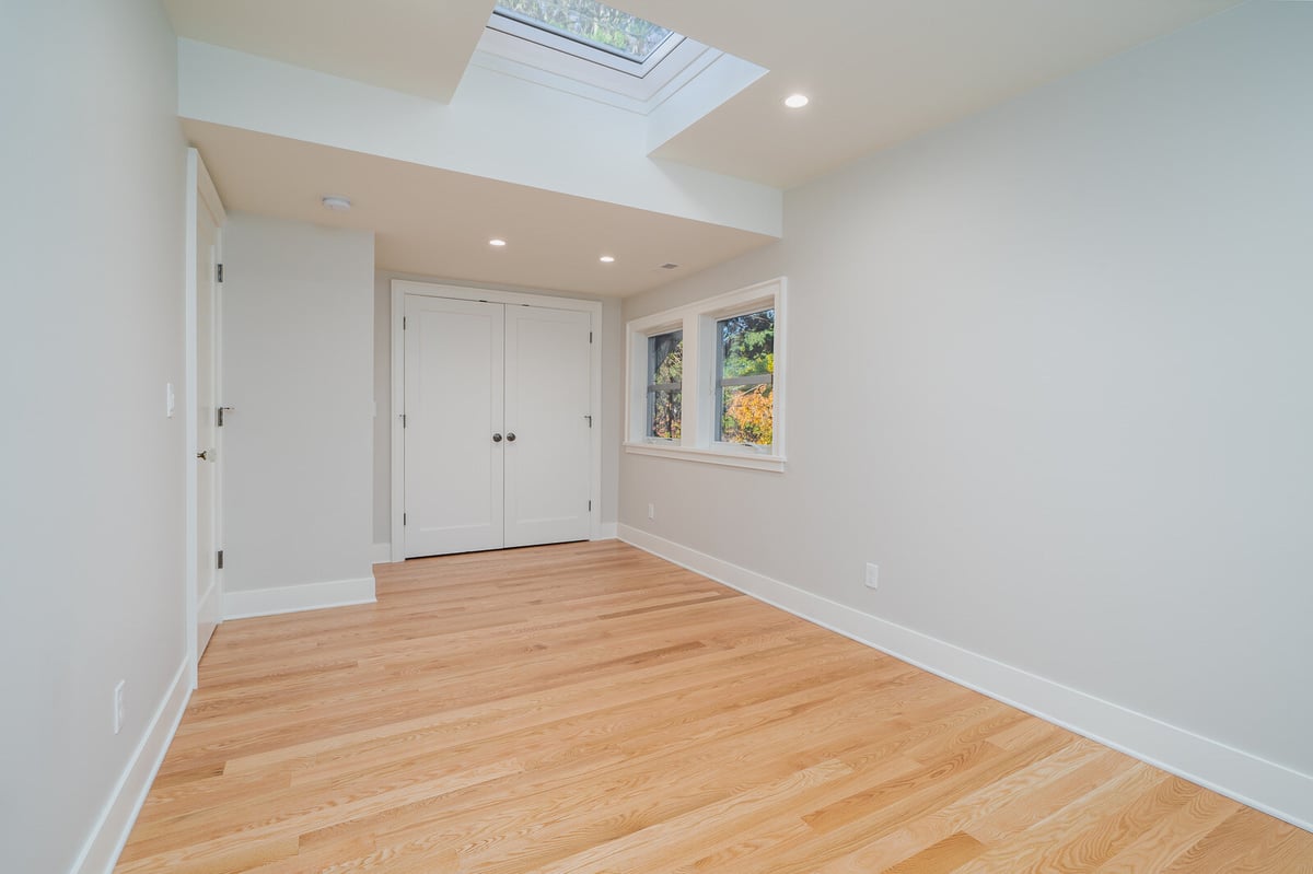 Modern living room with skylight and closet space, part of a CB Construction remodel in Seattle