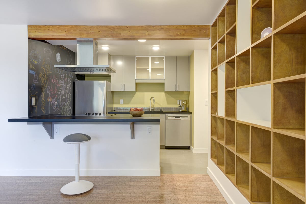 Contemporary kitchen in a Seattle basement ADU with a chalkboard accent wall, remodeled by CB Construction