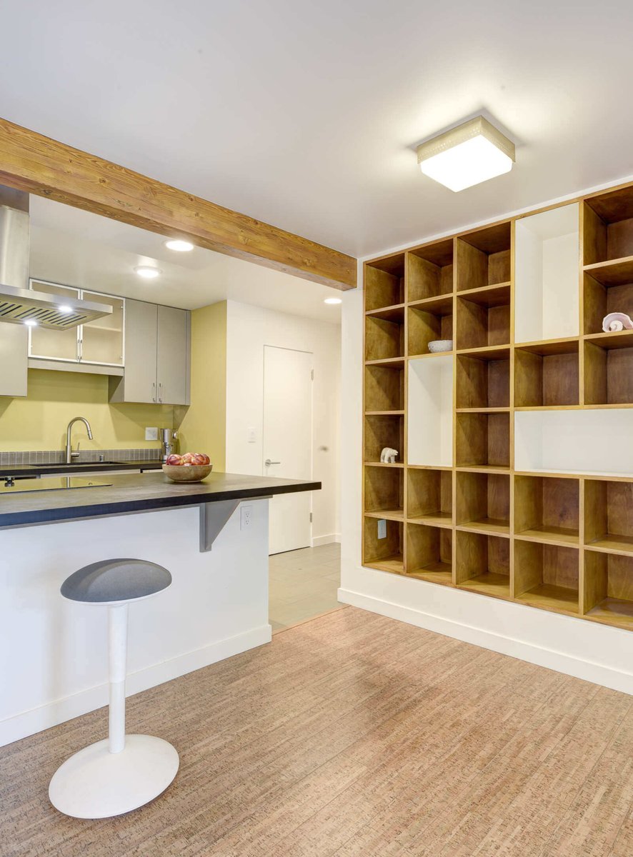 Kitchen island with seating in a Seattle basement ADU, offering modern amenities and design, by CB Construction