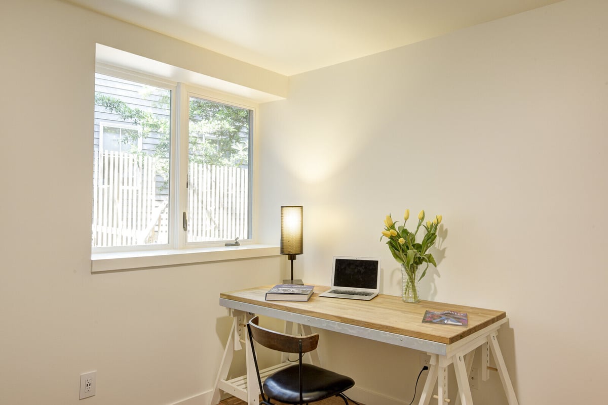 Small home office with modern design in a Seattle basement ADU, created by CB Construction