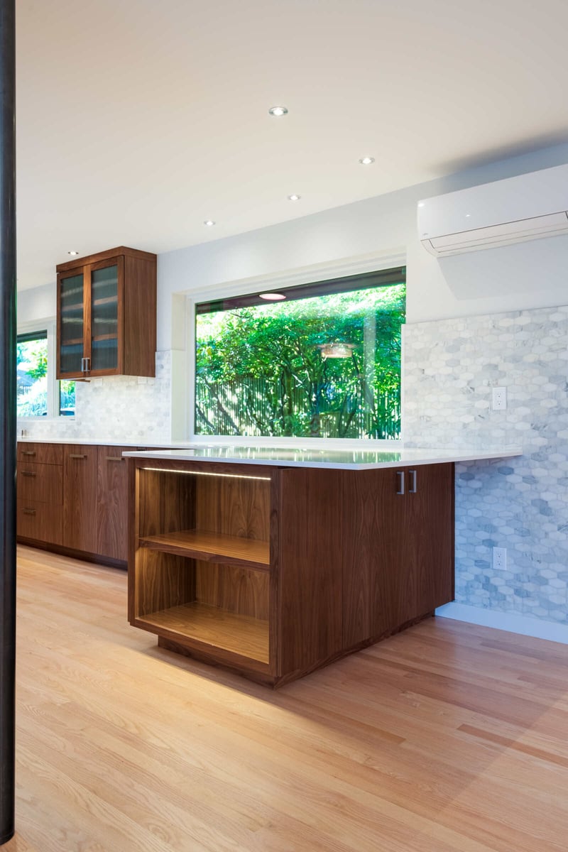 Bright kitchen with long countertops and wood cabinets, CB Construction, Seattle