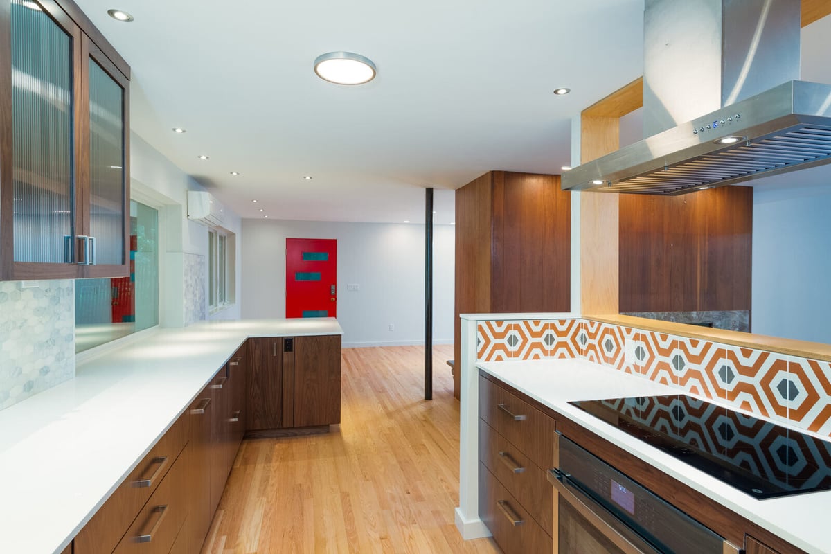 Living room and kitchen combo with custom wood cabinets and marble fireplace, CB Construction, Seattle