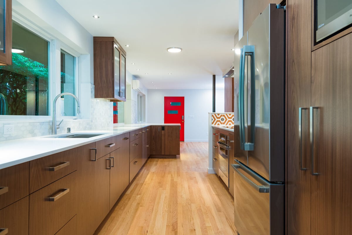 Sleek modern kitchen remodel with wood cabinetry and stainless steel appliances, CB Construction, Seattle