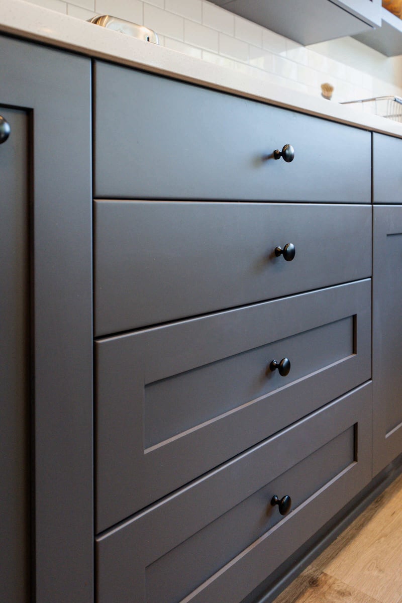 Close-up of grey kitchen cabinets in a modern Seattle kitchen by CB Construction