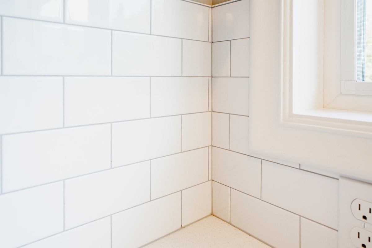 White subway tile backsplash detail in a modern kitchen remodeled by CB Construction in Seattle