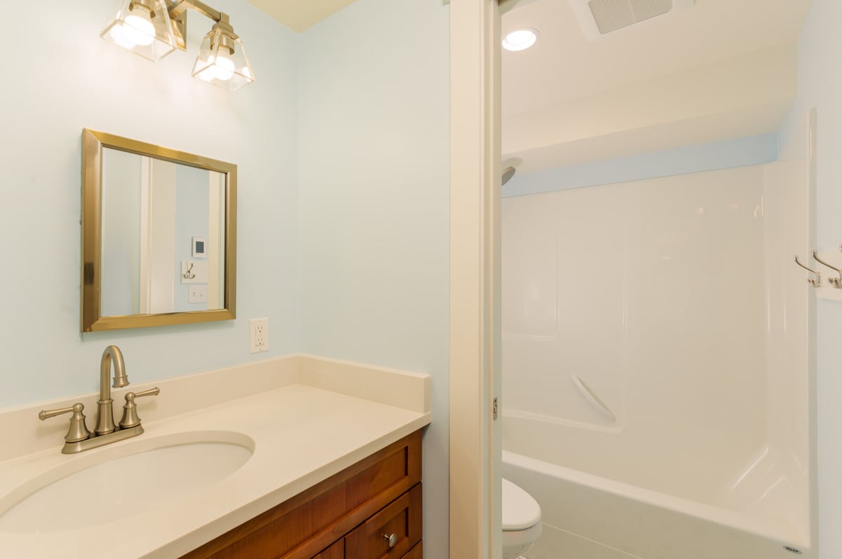 Doorway leading to a newly remodeled basement bathroom in Seattle, by CB Construction