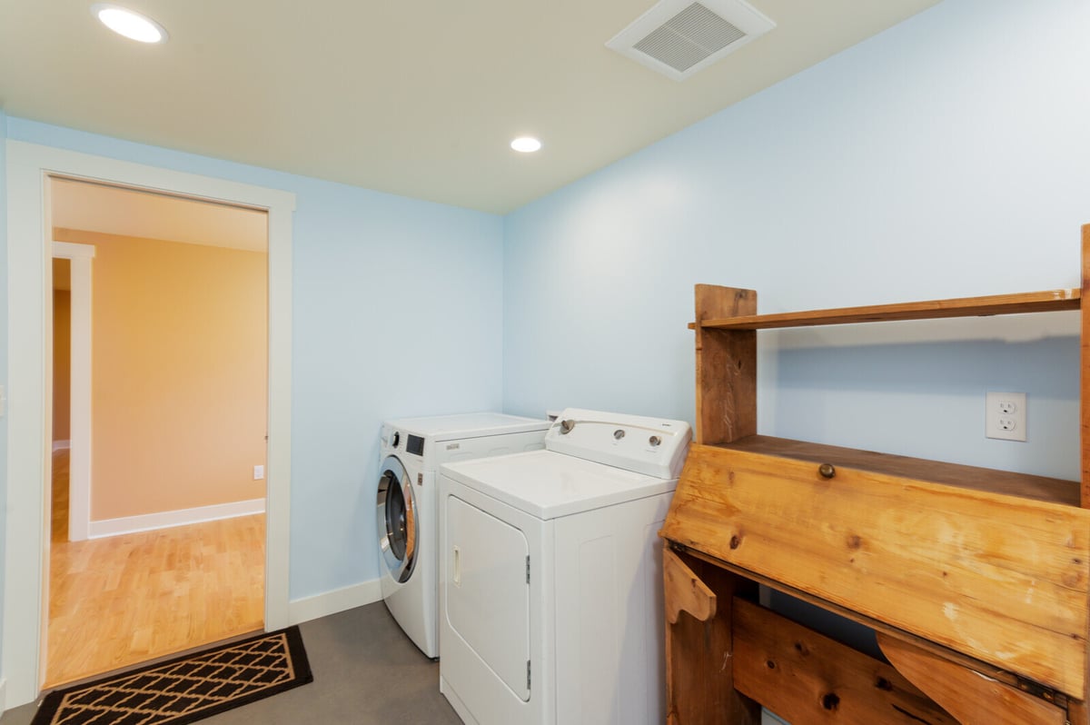 View of newly remodeled basement bathroom with modern sink and light blue walls in Seattle, by CB Construction