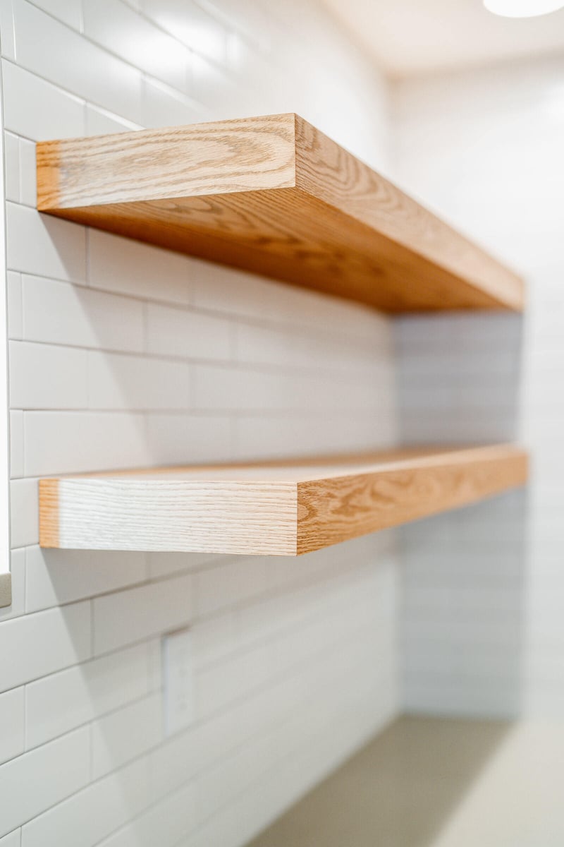 Close-up of floating wooden shelves in a Seattle ADU kitchen remodel by CB Construction