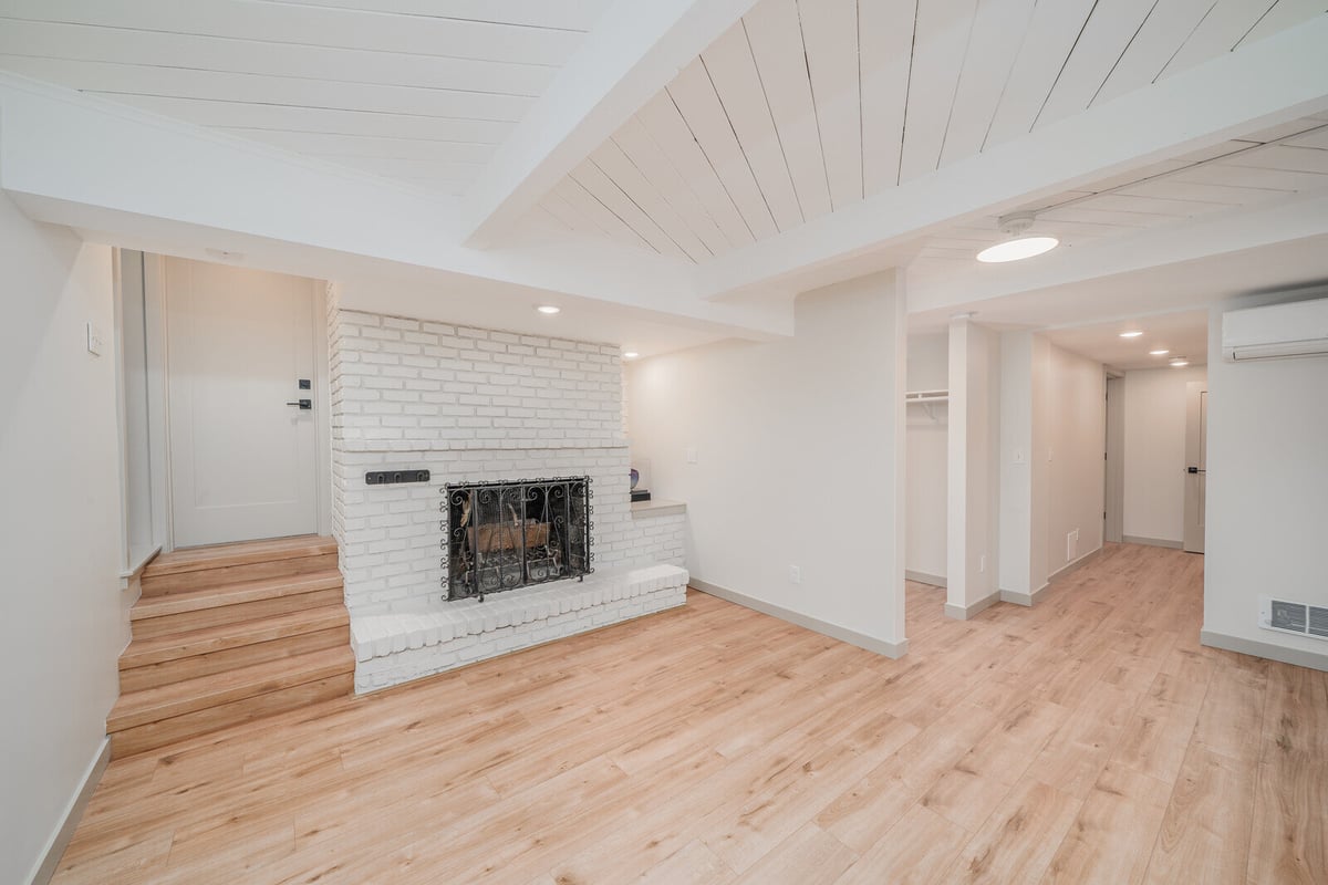 Renovated Seattle basement ADU living area with a focus on natural light, by CB Construction