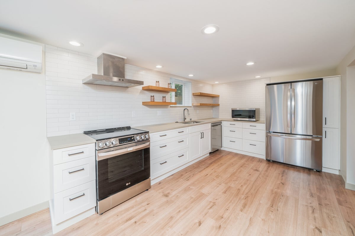 Stylish kitchen renovation in a Seattle basement ADU by CB Construction with ample storage space