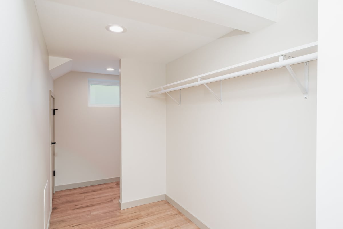 Updated laundry room in a Seattle basement ADU, featuring energy-efficient washer, by CB Construction