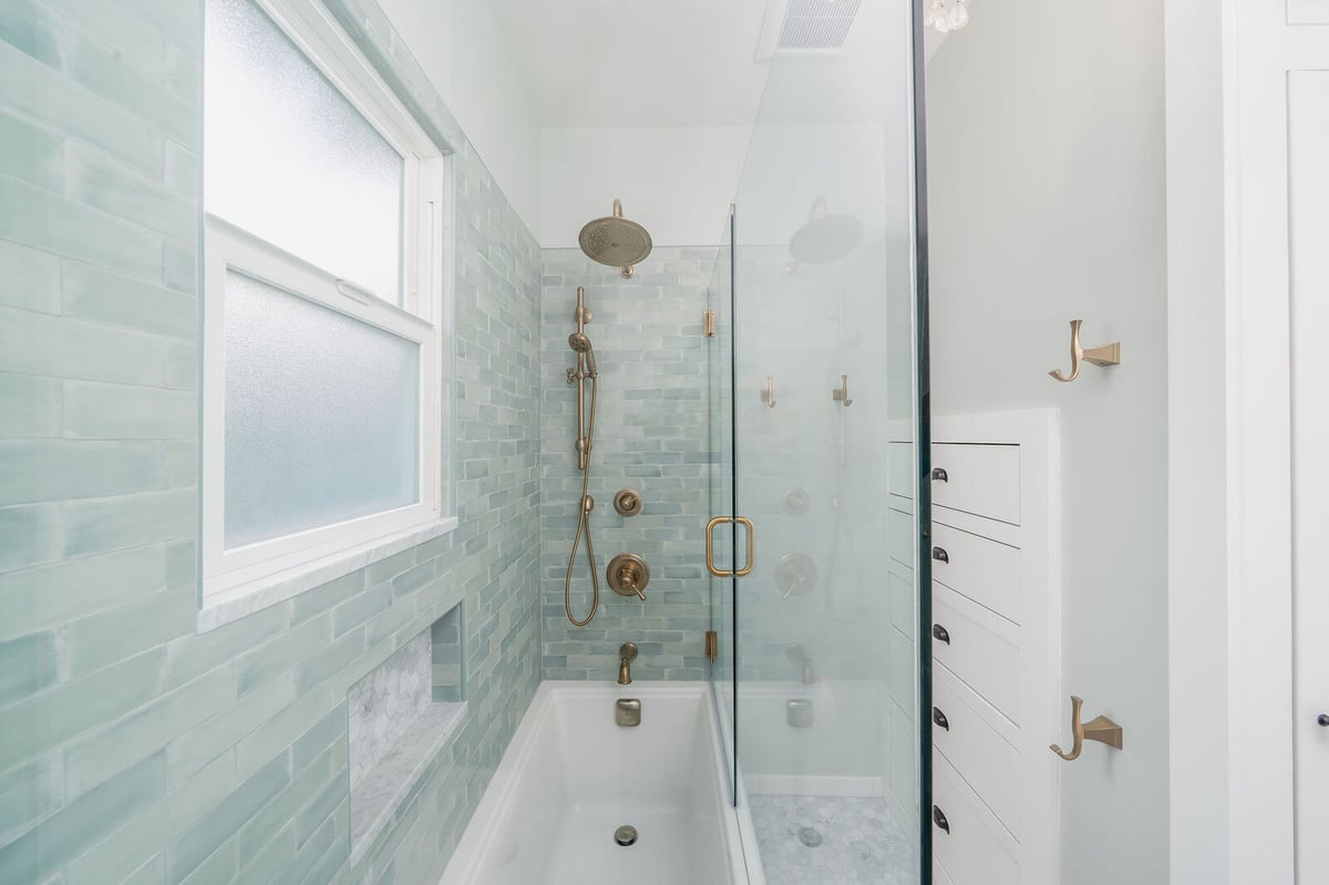 Marble hexagon tile in a bathroom remodel by CB Construction in Seattle