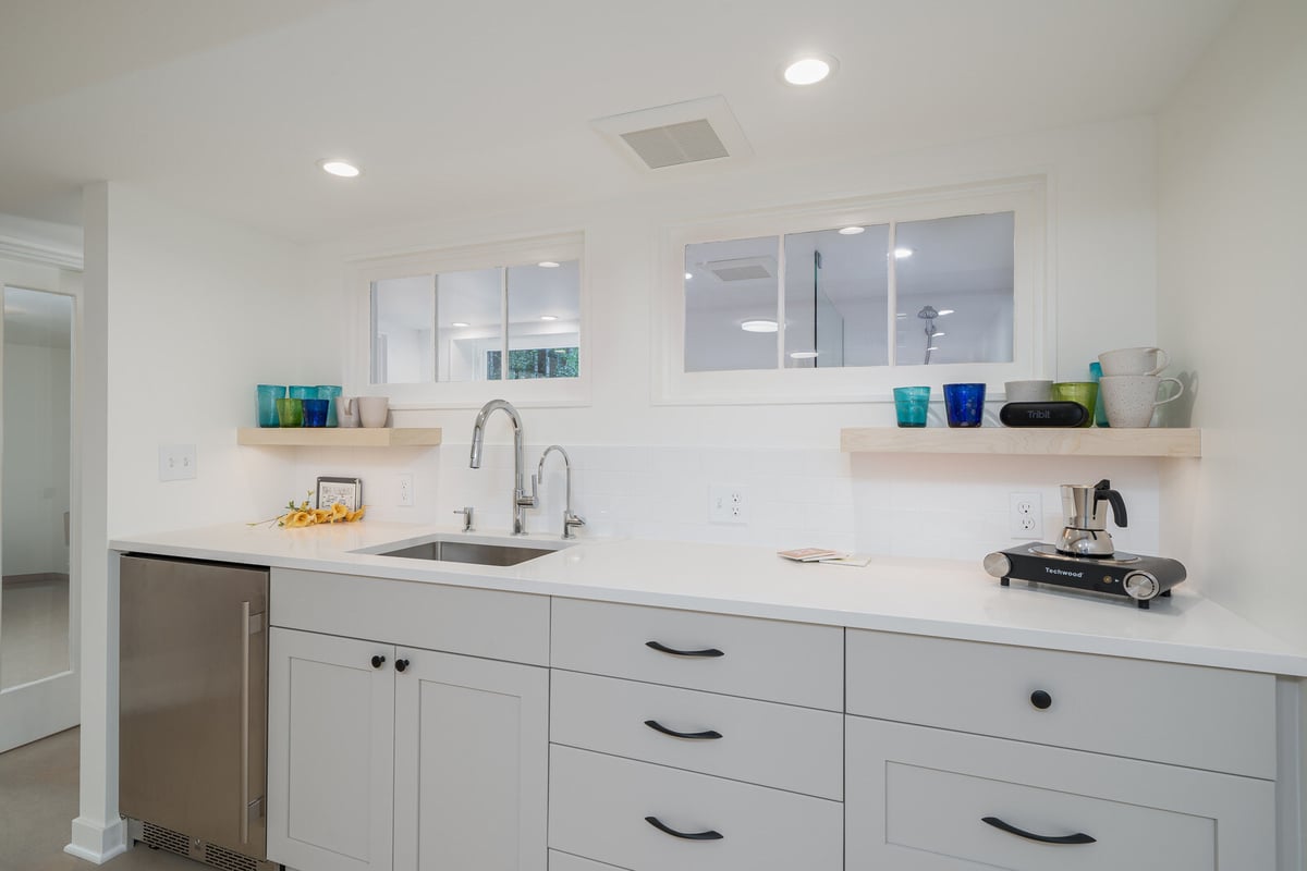 Elegant kitchen setup in a remodeled Seattle basement by CB Construction